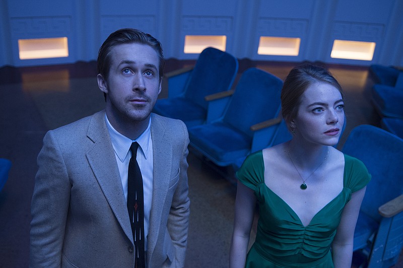 This image released by Lionsgate shows Ryan Gosling, left, and Emma Stone in a scene from, "La La Land." (Dale Robinette/Lionsgate via AP)