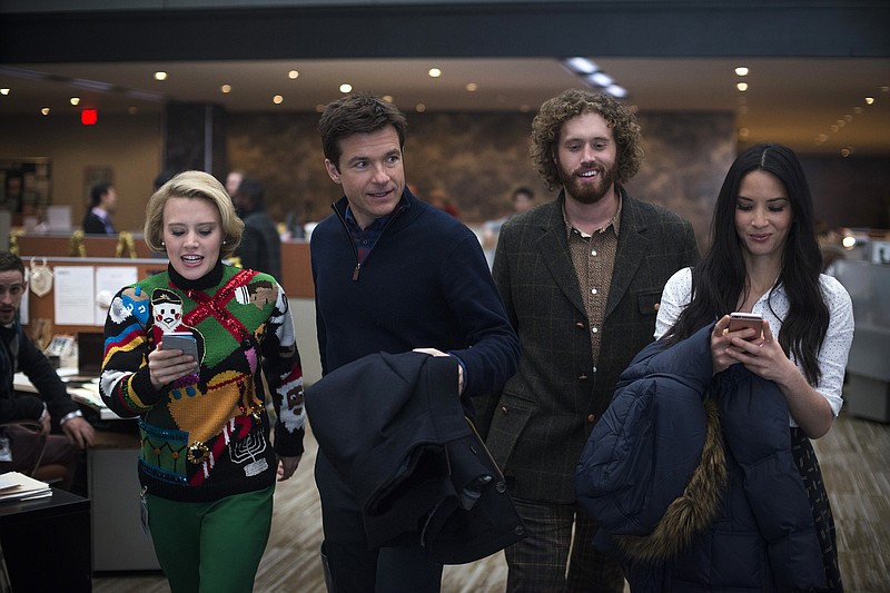 This image released by Paramount Pictures shows, from left, Kate McKinnon, Jason Bateman, T.J. Miller and Olivia Munn in a scene from "Office Christmas Party." (Glen Wilson/Paramount Pictures via AP)
