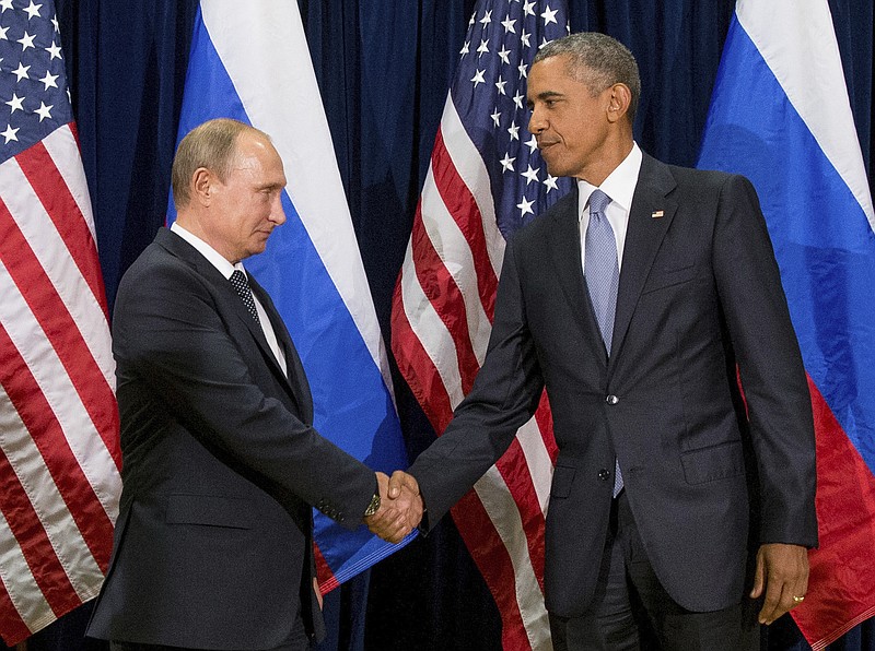 In this Sept. 28, 2015, file photo, President Barack Obama shakes hands with Russian President President Vladimir Putin before a bilateral meeting at United Nations headquarters.