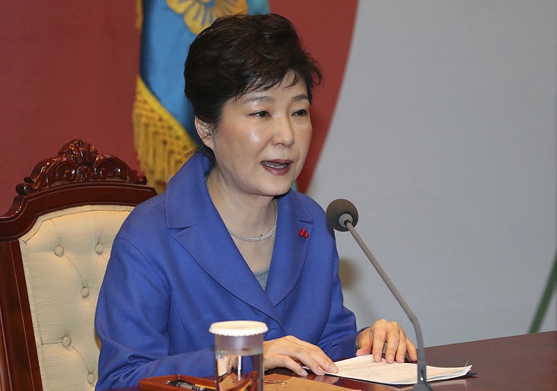 South Korean President Park Geun-hye speaks during an emergency Cabinet meeting at the presidential office in Seoul, South Korea, Friday, Dec. 9, 2016. South Korean lawmakers earlier on Friday impeached Park, a stunning and swift fall for the country's first female leader amid protests that drew millions into the streets in united fury. (Baek Sung-ryul/Yonhap via AP)