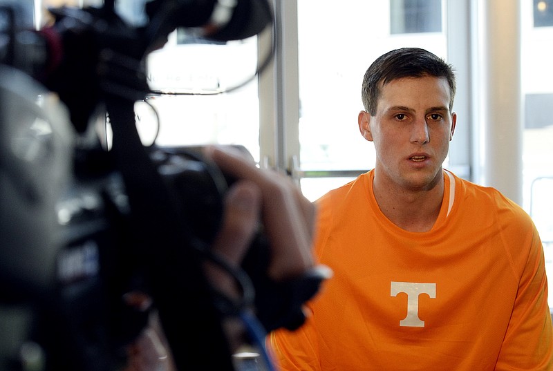 FILE - In this Oct. 19, 2016, file photo, Tennessee forward Lew Evans answers a question during the Southeastern Conference men's NCAA college basketball media day, in Nashville, Tenn.  Tennessee finally is opening a season without adapting to a coaching change, and yet the Volunteers are still starting over in a certain respect. The list of newcomers includes seven true freshmen as well as redshirt freshman Lamonte Turner and Utah State graduate transfer Lew Evans. (AP Photo/Mark Zaleski, File)