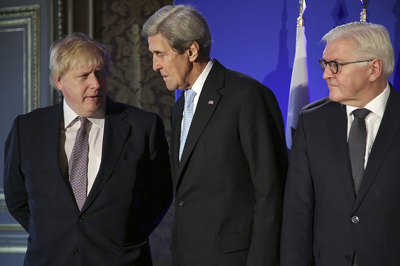 
              U.S. Secretary of State John Kerry, center, British Foreign Secretary Boris Johnson, left, and German Foreign Minister Frank-Walter Steinmeier, talk during a family picture prior to a meeting, in Paris, Saturday, Dec. 10, 2016. Kerry and leading diplomats are trying to find solutions for Syria's desperate opposition, as Syrian government forces squeeze rebels out of Aleppo after a devastating blitz. (AP Photo/Thibault Camus, Pool)
            