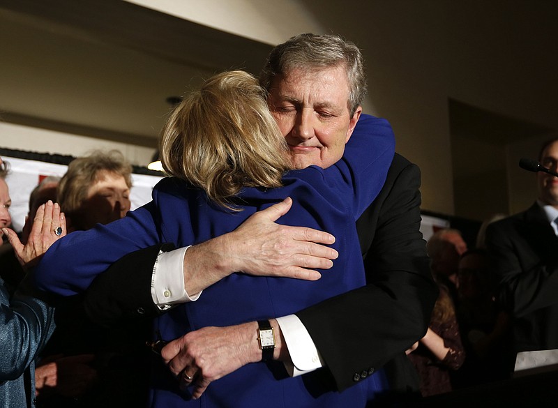
              Louisiana state treasurer John Kennedy hugs his wife Becky after addressing supporters at his election watch party, after being elected to the senate seat vacated by Sen. David Vitter, R-La., in Baton Rouge, La., Saturday, Dec. 10, 2016. (AP Photo/Gerald Herbert)
            