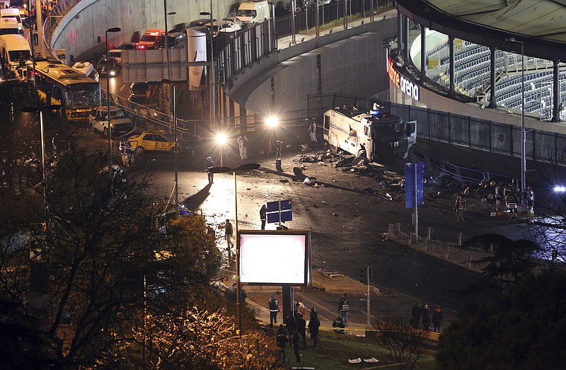 
              Rescue services work at the scene of explosions near the Besiktas football club stadium after attacks in Istanbul, late Saturday, Dec. 10, 2016. Two explosions struck Saturday night outside a major soccer stadium in Istanbul after fans had gone home, an attack that wounded about 20 police officers, Turkish authorities said. Turkish authorities have banned distribution of images relating to the Istanbul explosions within Turkey.(DHA via AP)
            