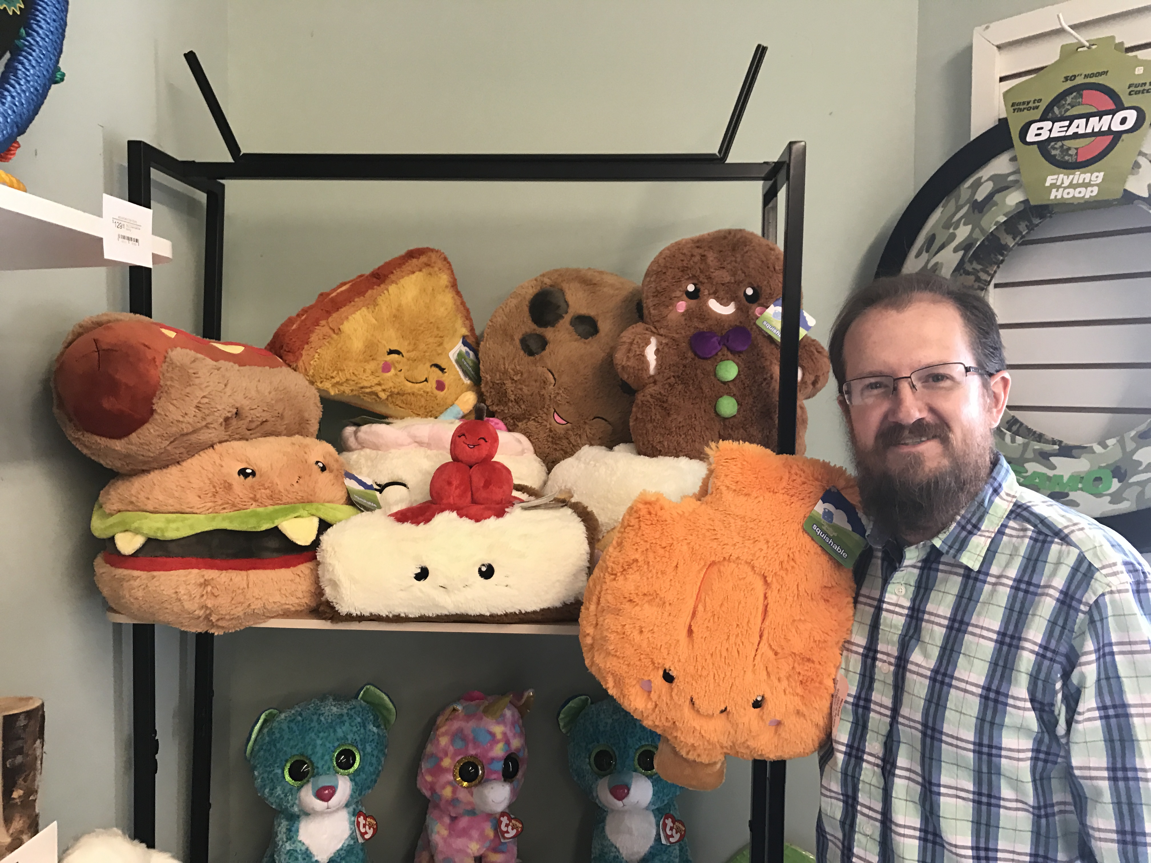 Mountain Top Toys owner Patrick Holland displays Squishables' line of plush toys in comfort food shapes. Mountain Top is the only store in the area that carries Squishables, he said.