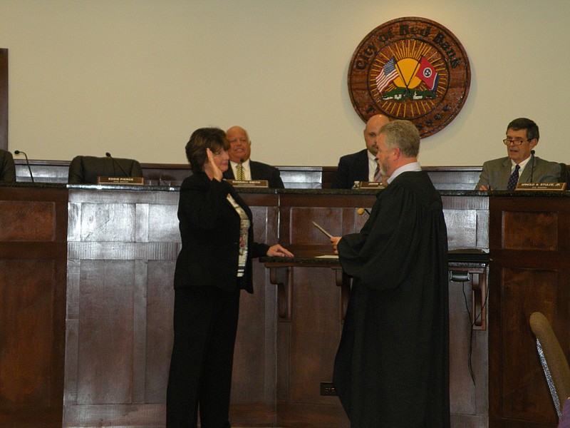 New Red Bank City Commissioner Carol Rose is sworn in by Judge Johnny Houston.