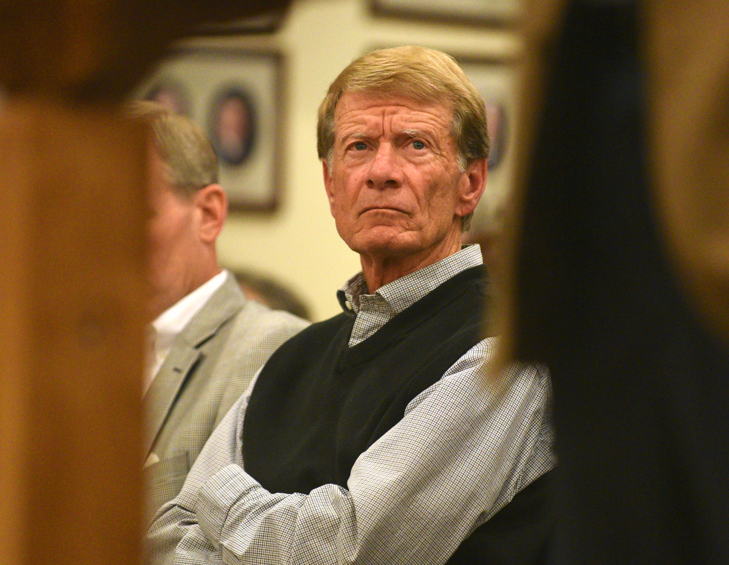Tom McCullough listens as Rob Hensley speaks during a town council meeting Monday, Dec. 12, 2016, at the Signal Mountain Town Hall.