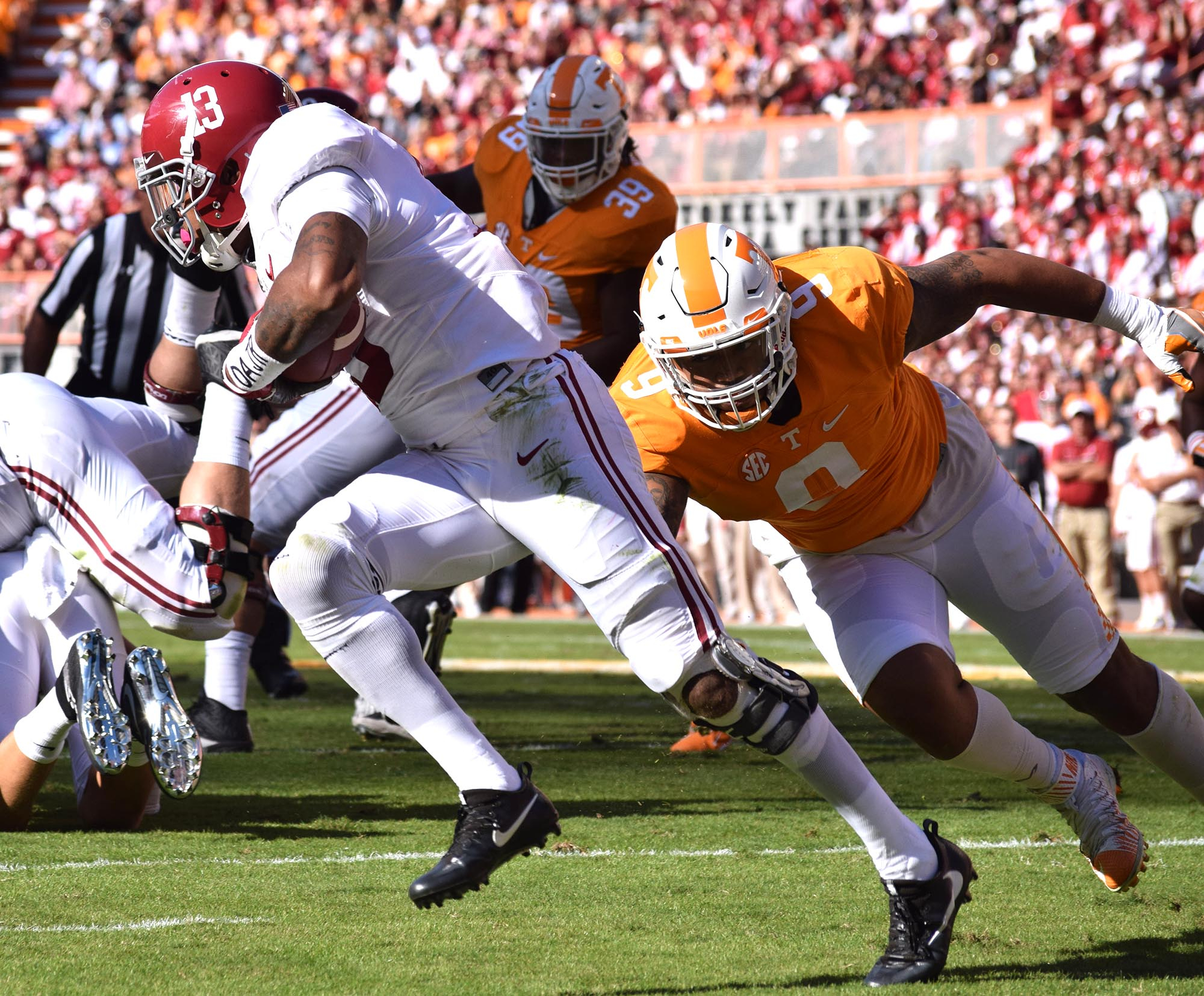 Tennessee's Derek Barnett (9) misses a tackle on Alabama's ArDarius Stewart (13). The top-ranked University of Alabama Crimson Tide visited the University of Tennessee Volunteers in SEC football action on October 15, 2016