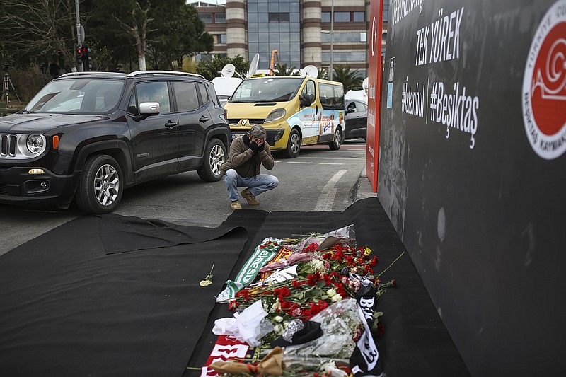 
              A man prays outside the Besiktas football club stadium Vodafone Arena in Istanbul, Monday, Dec. 12, 2016. Turkey launched a full investigation and bury the dead Monday after two bombings in Istanbul killed dozens of people and wounded score others near Besiktas' stadium. Turkish authorities have banned distribution of images relating to the Istanbul explosions within Turkey.(AP Photo/Emrah Gurel)
            