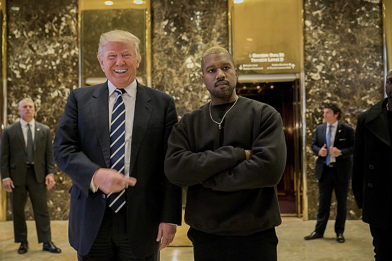 President-elect Donald Trump with Kanye West in the lobby of Trump Tower on Fifth Avenue in New York on Tuesday. (Sam Hodgson/The New York Times)