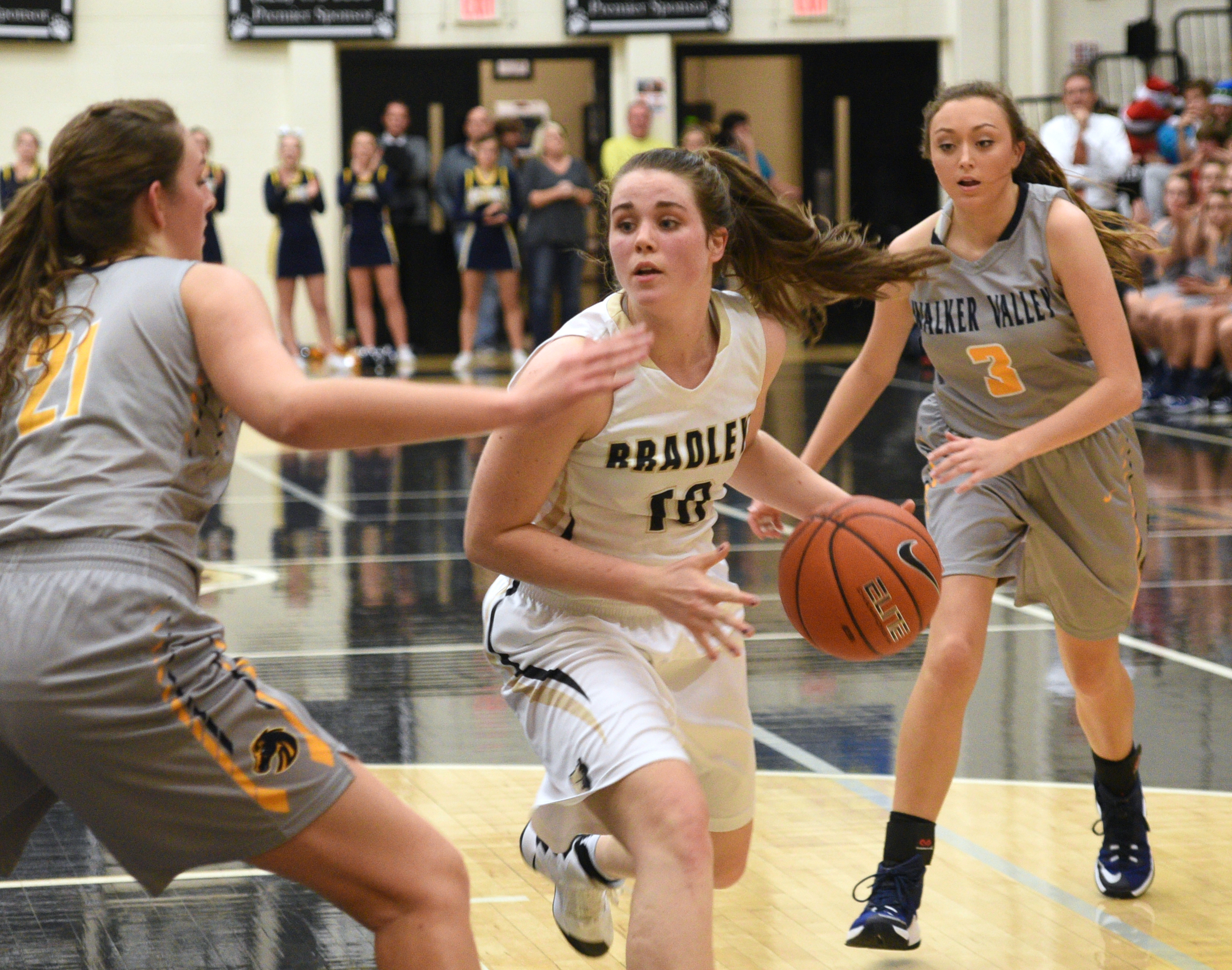 Bradley Central's Emma Kate Brown is surrounded by Walker Valley's Haley Jones, left, and Kaley Walker Tuesday, Dec. 13, 2016, at Bradley Central High School.