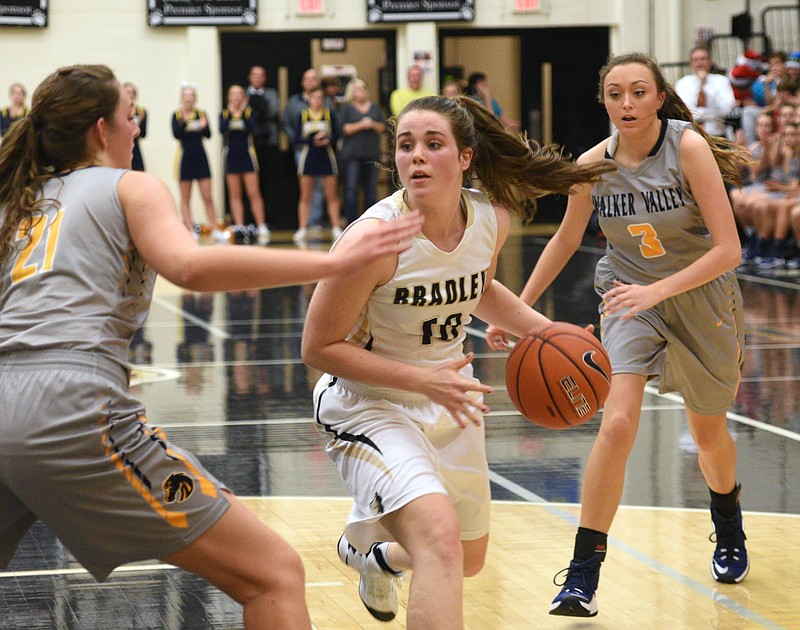 Bradley Central's Emma Kate Brown is surrounded by Walker Valley's Haley Jones, left, and Kaley Walker Tuesday, Dec. 13, 2016, at  Bradley Central High School.