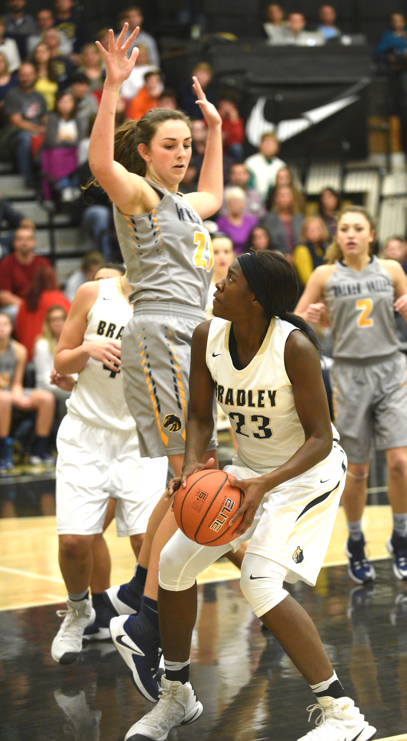 Bradley Central's Rhyne Howard is guarded by Walker Valley's Haley Jones Tuesday, Dec. 13, 2016, at Bradley Central High School.