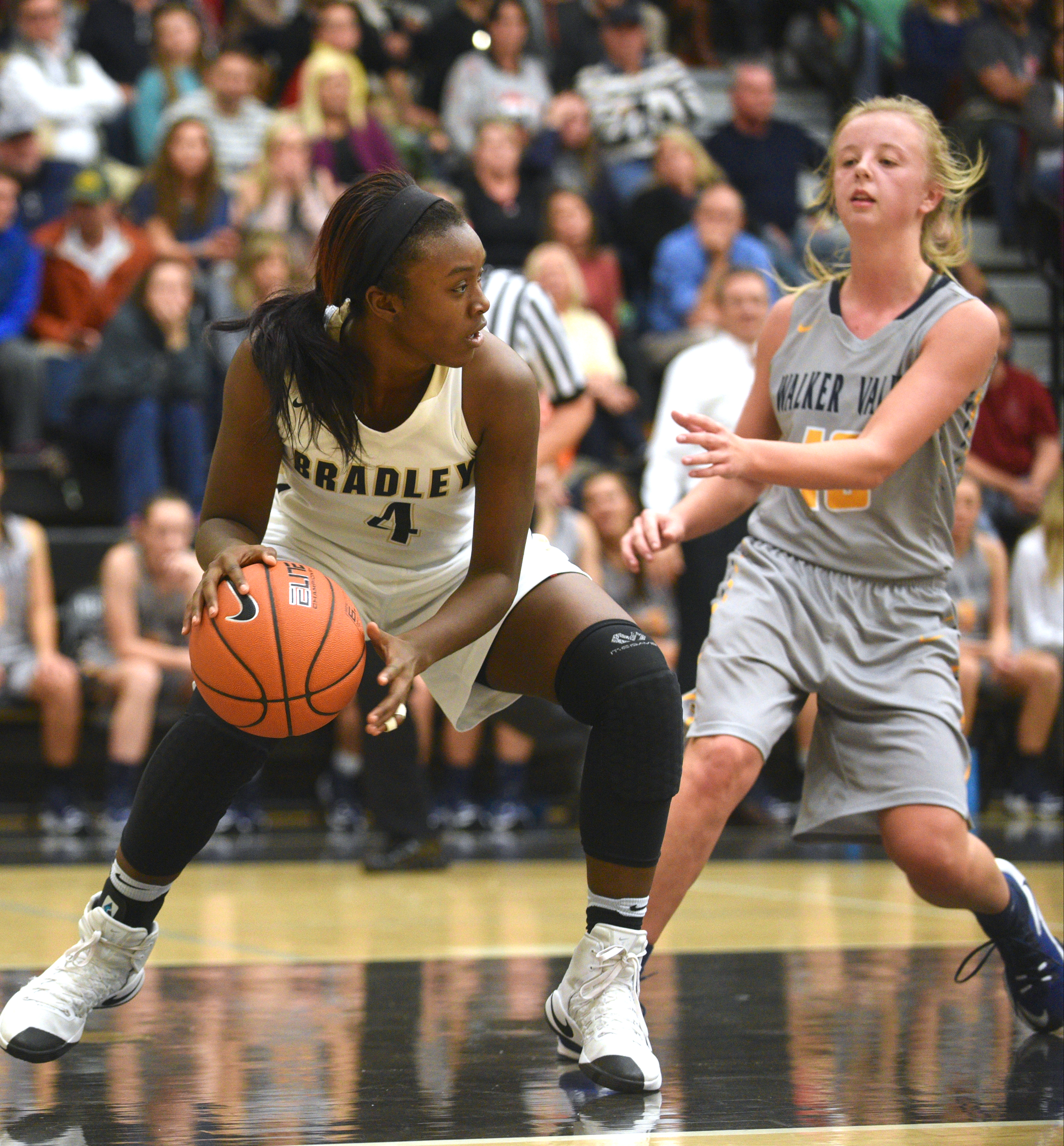 Bradley Central's Kimia Carter is guarded by Walker Valley's Macey Clark Tuesday, Dec. 13, 2016, at Bradley Central High School.