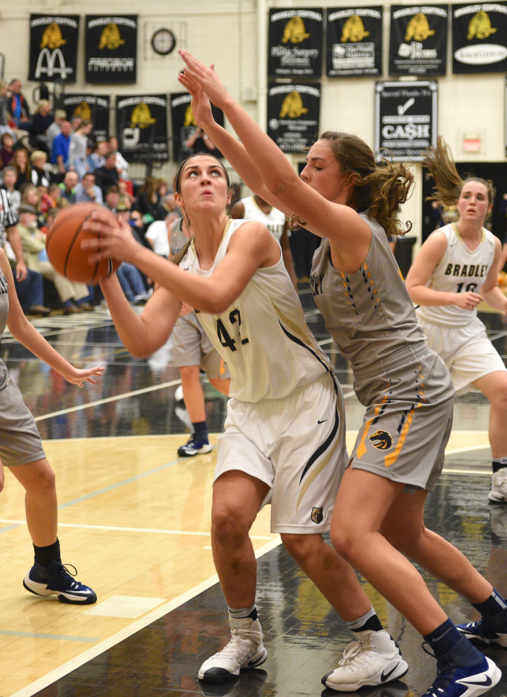 Bradley Central's Kailey McRee is guarded by Walker Valley's Haley Jones Tuesday, Dec. 13, 2016, at Bradley Central High School.