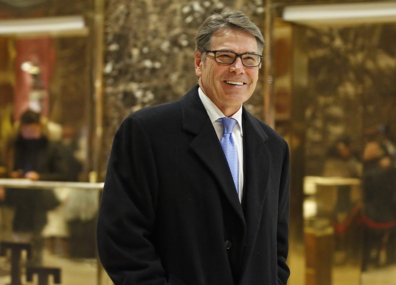 In this Dec. 12, 2016, file photo, former Texas Gov. Rick Perry smiles as he leaves Trump Tower in New York. Perry is President-elect Donald Trump's choice to become energy secretary, two people with knowledge of the decision say. (AP Photo/Kathy Willens, File)