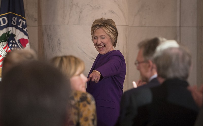 Hillary Clinton attends the ceremonial unveiling of an official portrait of Harry Reid, the outgoing Senate Minority Leader, on Capitol Hill in Washington, on Dec. 8.