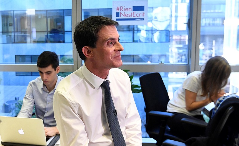 
              Former French Prime Minister Manuel Valls, now candidate for the socialist party primary election, gestures during the inauguration of his campaign headquarters, Wednesday Dec. 14, 2016, in Paris. Valls hopes to unite the Socialists under his banner and give the left a chance to stay at the Elysee, in the most ambitious challenge of his political life after president Francois Hollande decided not to run for re-election next year. (Alain Jocard, Pool via AP)
            
