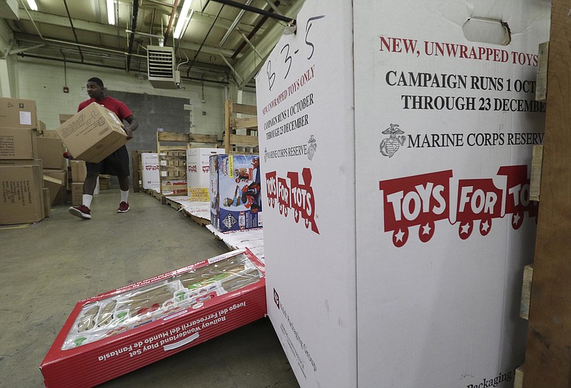Staff Photo by Dan Henry / The Chattanooga Times Free Press- 12/15/16. Cpl. Christian Durrah sorts toys into gender and age group bins for the Toys for Tots organization on Thursday, December 15, 2016. 