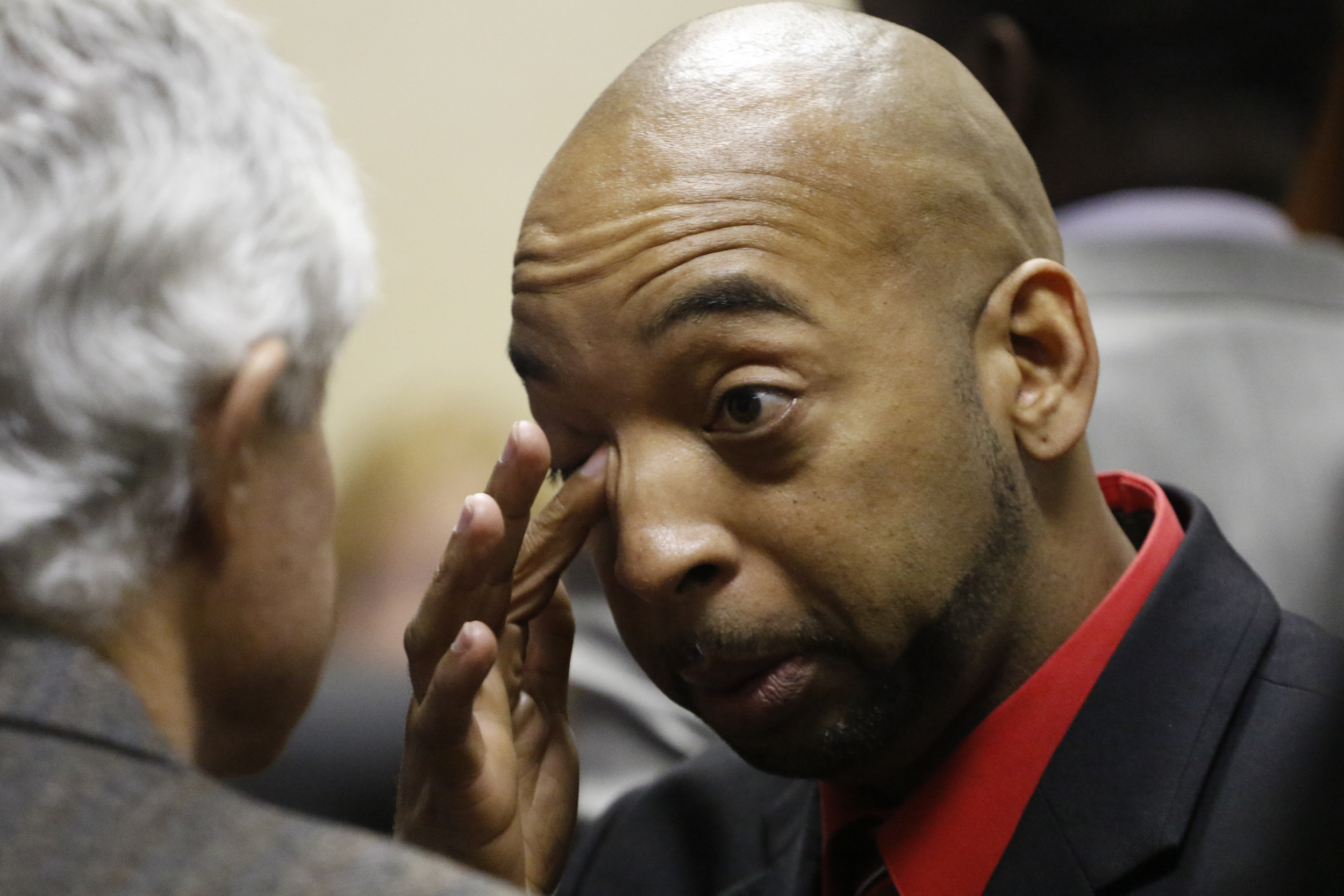 Staff Photo by Dan Henry / The Chattanooga Times Free Press- 2/15/16. Ooltewah High School head basketball coach Andre "Tank" Montgomery rubs his eye during a brief intermission from his preliminary hearing in Hamilton County Juvenile Court on February 25, 2016. Hamilton County District Attorney Neal Pinkston charged head coach Andre "Tank" Montgomery, assistant coach Karl Williams and Athletic Director Allard "Jesse" Nayadley with failing to report child abuse or suspected child sexual abuse in connection with the rape of an Ooltewah High School freshman by his basketball teammates Dec. 22, 2015.