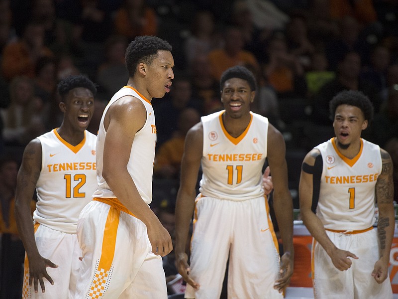 Tennessee's Grant Williams, second from left, is cheered by teammates after scoring against Lipscomb during the second half of an NCAA college basketball game in Knoxville, Tenn., Thursday, Dec. 15, 2016. (Caitie McMekin/Knoxville News Sentinel via AP)