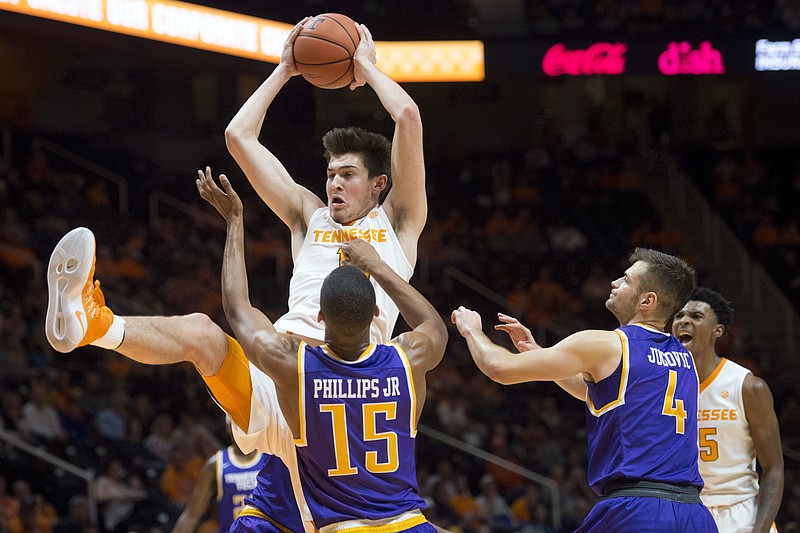 Tennessee's John Fulkerson grabs a rebound in last Tuesday's win over Tennessee Tech in Knoxville. Two nights later he sustained a gruesome elbow injury against Lipscomb.