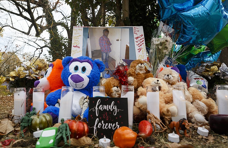 Teddy bears, mementos, and balloons have been placed at the site of a fatal school bus crash on Talley Road on Wednesday, Nov. 23, 2016, in Chattanooga, Tenn. The makeshift memorial to victims of the Monday crash, which killed 5 Woodmore Elementary students and injured dozens more, has grown since the road was reopened Tuesday.