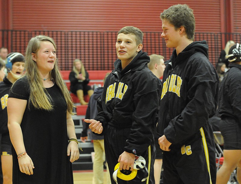 On the road at Baylor last week, Bradley Central wrestling manager and wrestling brothers enjoy a moment together before the match. The birth triplets from left are, Amanda Hicks, Trey Hicks and T.J. Hicks. 