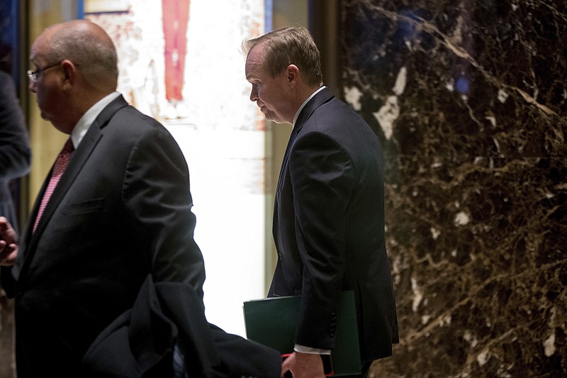 
              FILE - In this Dec. 5, 2016, file photo, Rep. Mick Mulvaney, R-S.C., center, leaves Trump Tower in New York. President-elect Donald Trump has chosen Mulvaney as his budget director, naming a tough-on-spending conservative and an advocate of balancing the federal budget to the important post. (AP Photo/Andrew Harnik, File)
            