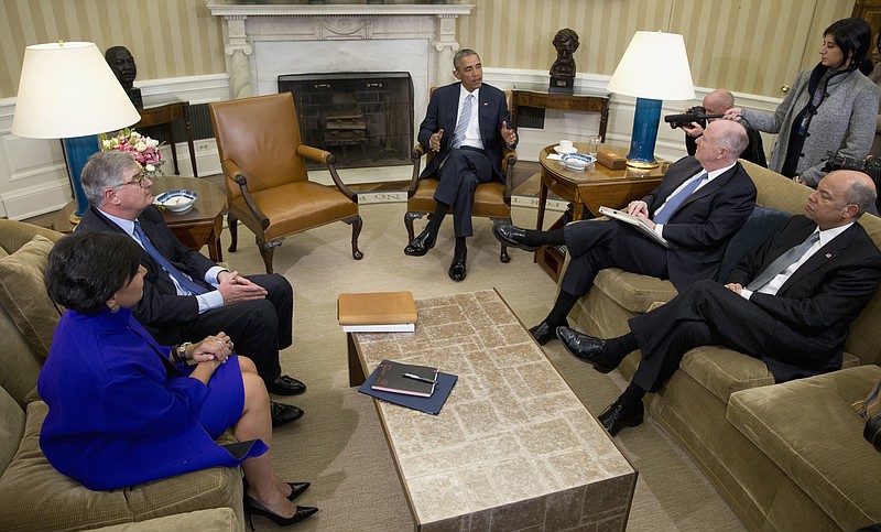 United States President Barack Obama, center, discusses cybersecurity in February 2016 with advisers.