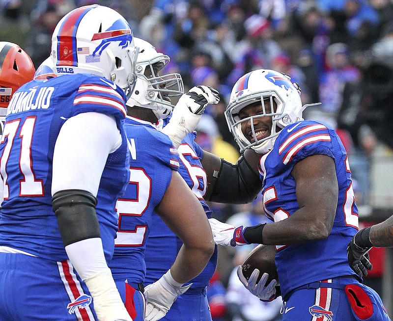 
              Buffalo Bills running back LeSean McCoy, right, celebrates after scoring on a touchdown run against the Cleveland Browns during the second half of an NFL football game, Sunday, Dec. 18, 2016, in Orchard Park, N.Y. (AP Photo/Bill Wippert)
            