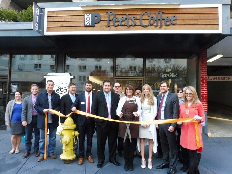 Defoor Brothers representatives pose with members of the Chattanooga Chamber of Commerce to celebrate the grand opening of Peet's Coffee.