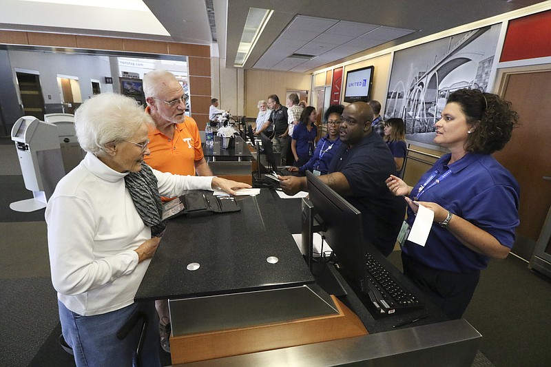 Staff Photo by Dan Henry / The Chattanooga Times Free Press- 9/7/16. Lenora Yarbrough, left, and her son Richard Yarbrough check in to United Airlines's first direct flight to the New York area on September 7, 2016.