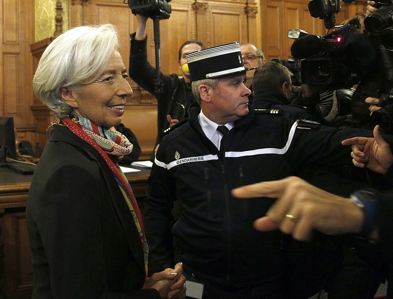 
              FILE - In this Monday, Dec. 12, 2016 file picture, International Monetary Fund chief Christine Lagarde, right, arrives at the special Paris court, France. French court finds IMF chief Christine Lagarde guilty in arbitration case, but she escapes punishment. (AP Photo/Thibault Camus, File)
            