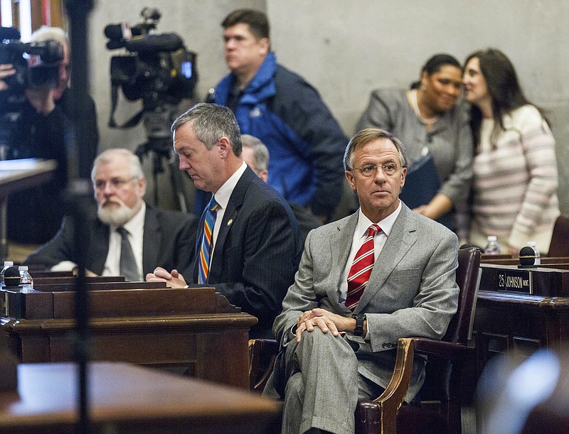 
              Republican Gov. Bill Haslam, bottom right, and Secretary of State Tre Hargett, bottom center, await the state's Electoral College vote in the House chamber in Nashville, Tenn., on Monday, Dec. 19, 2016. Tennessee's 11 presidential electors on Monday cast their ballots for Republican Donald Trump amid protesters demanding they stray from their legal obligation to support the candidate who carried the state. (AP Photo/Erik Schelzig)
            