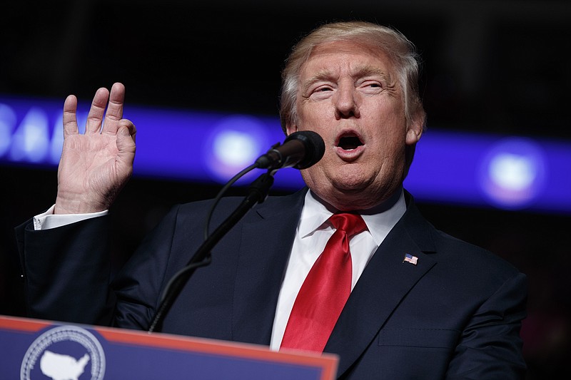 
              FILE - In this Thursday, Dec. 15, 2016, file photo, President-elect Donald Trump speaks during a rally at the Giant Center in Hershey, Pa. Trump's closest advisers see Democrats' complaints that Moscow hacked their private emails this election season as a case of sour grapes. The pushback comes ahead of the Electoral College vote, Monday, Dec. 19, which is expected to make official Trump's election win. (AP Photo/Evan Vucci, File)
            