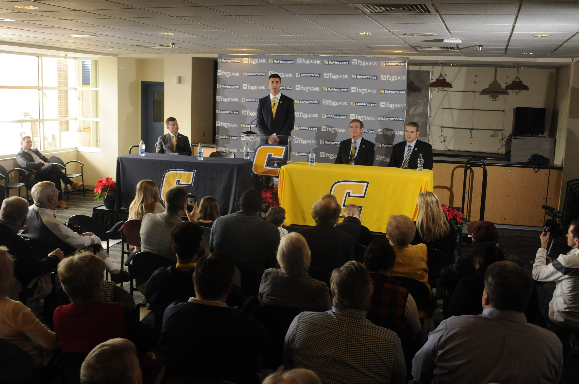 Tom Arth speaks to fans, the media and attending players as the new Chattanooga Mocs head football coach Tuesday inside the Stadium Club at Finley Stadium.