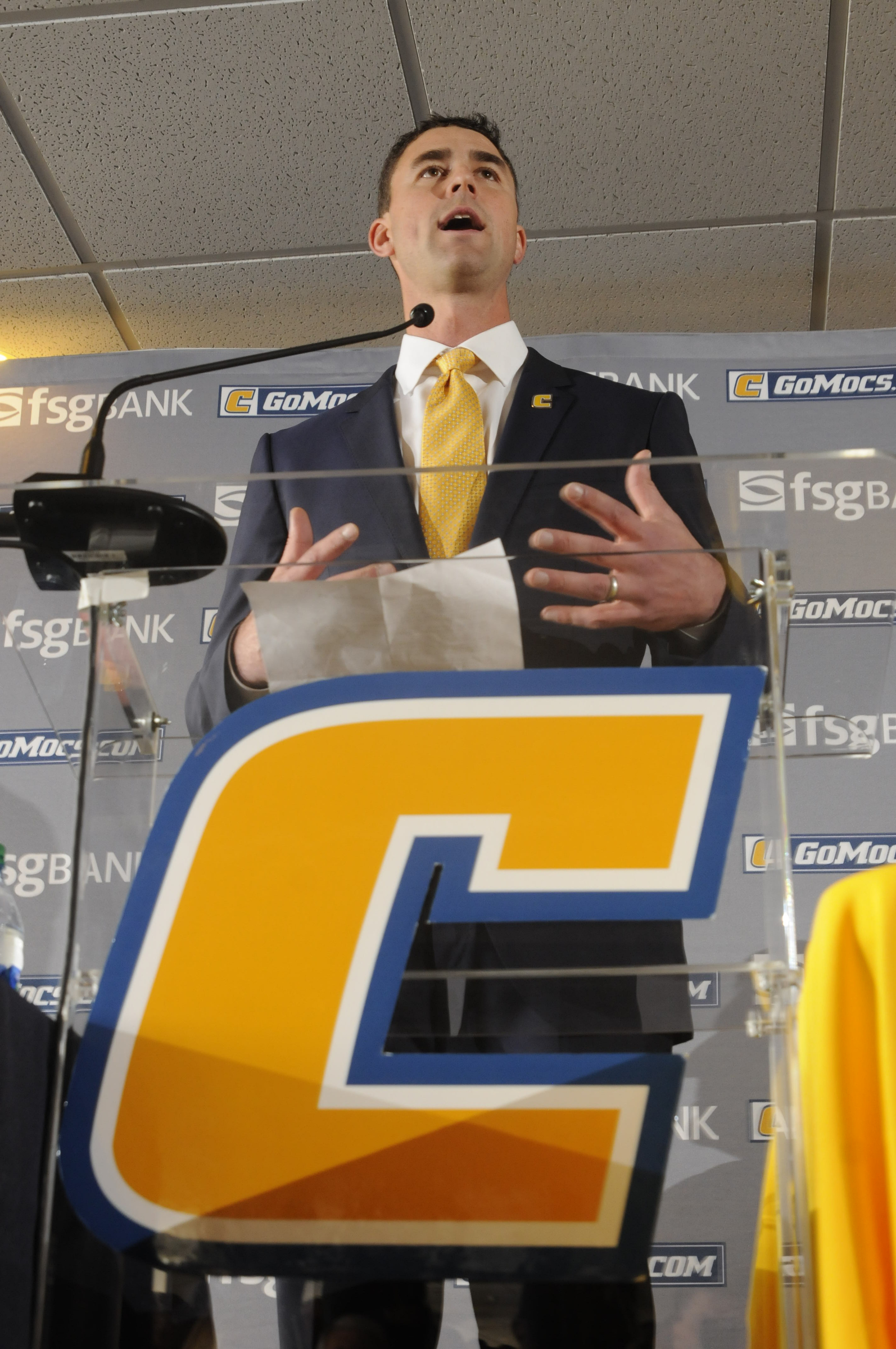 Tom Arth speaks to fans, the media and attending players as the new Chattanooga Mocs head football coach Tuesday inside the Stadium Club at Finley Stadium.