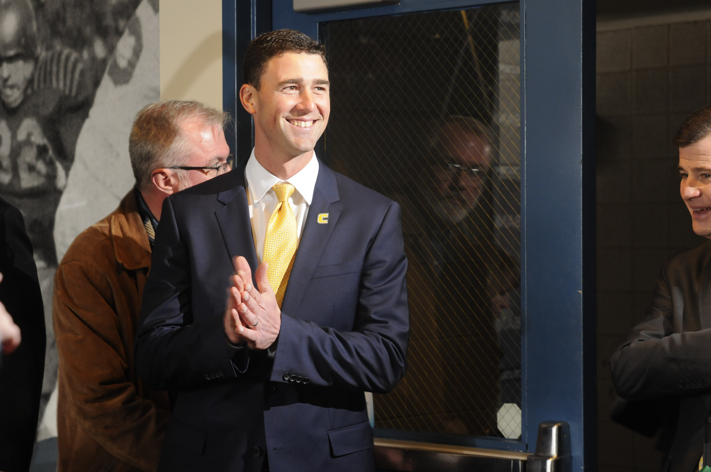 Tom Arth enters the Stadium Club Tuesday to speak to fans, the media and attending players for the first meeting as the new Chattanooga Mocs head football coach midday at Finley Stadium.