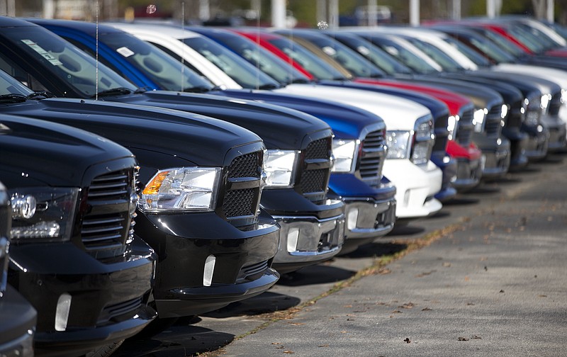 
              FILE - In this Jan. 5, 2015 file photo, Ram pickup trucks are on display on the lot at Landmark Dodge Chrysler Jeep RAM in Morrow, Ga. The U.S. auto safety agency has opened an investigation into complaints that another 1 million Fiat Chrysler vehicles can roll away after the owners shift transmissions into park, a problem similar to the one being blamed in the death of Star Trek actor Anton Yelchin.  The investigation by the National Highway Traffic Safety Administration covers Fiat Chrysler’s top-selling vehicle, the Ram 1500 pickup from the 2013 to 2016 model years, as well as the 2014 to 2016 Dodge Durango.  (AP Photo/John Bazemore, File)
            