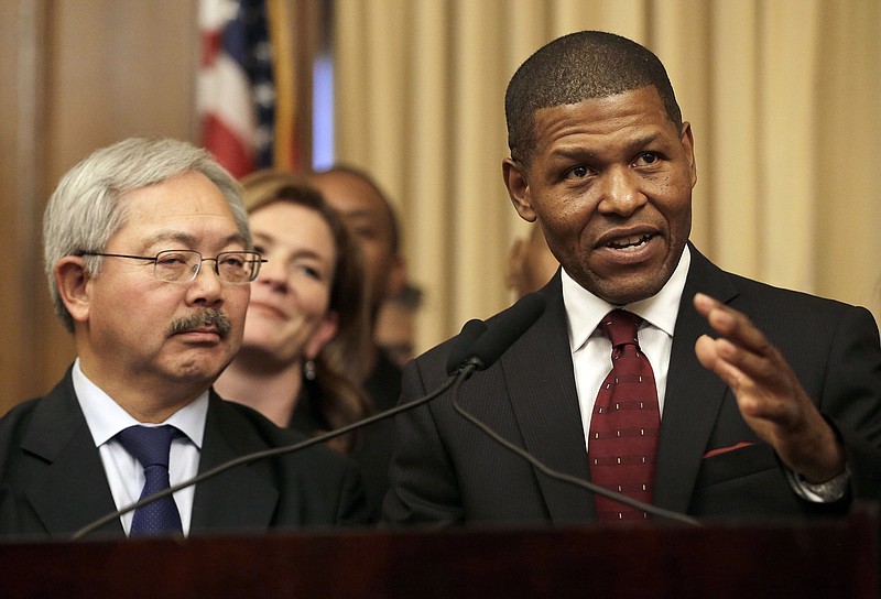 
              San Francisco Police Chief William Scott, right, speaks next to Mayor Ed Lee at a news conference in San Francisco, Tuesday, Dec. 20, 2016. San Francisco appointed Scott, a deputy chief of the Los Angeles Police Department, to head the city police department as it deals with a number of racially charged issues. (AP Photo/Jeff Chiu)
            
