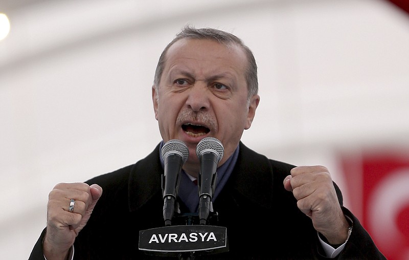 
              Turkey's President Recep Tayyip Erdogan gestures as he speaks during the opening ceremony of Eurasia Tunnel in Istanbul, Tuesday, Dec, 20, 2016. Erdogan said he and Russian President Vladimir Putin, with whom he spoke by phone Monday night, were "in agreement that this was an open provocation'', referring to the assassination of Russian ambassador to Turkey, Andrei Karlov, in Ankara Monday. (AP Photo)
            