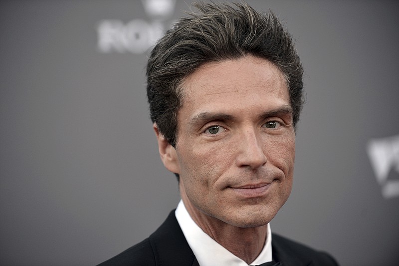 
              FILE- In this Sept. 30, 2013, file photo, Richard Marx arrives at the LA Philharmonic's Walt Disney Hall 10th Anniversary Celebration at Walt Disney Concert Hall in Los Angeles. Marx wrote Tuesday, Dec. 20, 2016, that he is not a hero for apparently intervening after an unruly passenger had to be forcibly restrained on a Korean Air flight between Hanoi and Seoul. Marx and his wife, former MTV VJ Daisy Fuentes, documented efforts to restrain the passenger on social media, and Marx later wrote that they were home safe. (Photo by Richard Shotwell/Invision/AP, File)
            