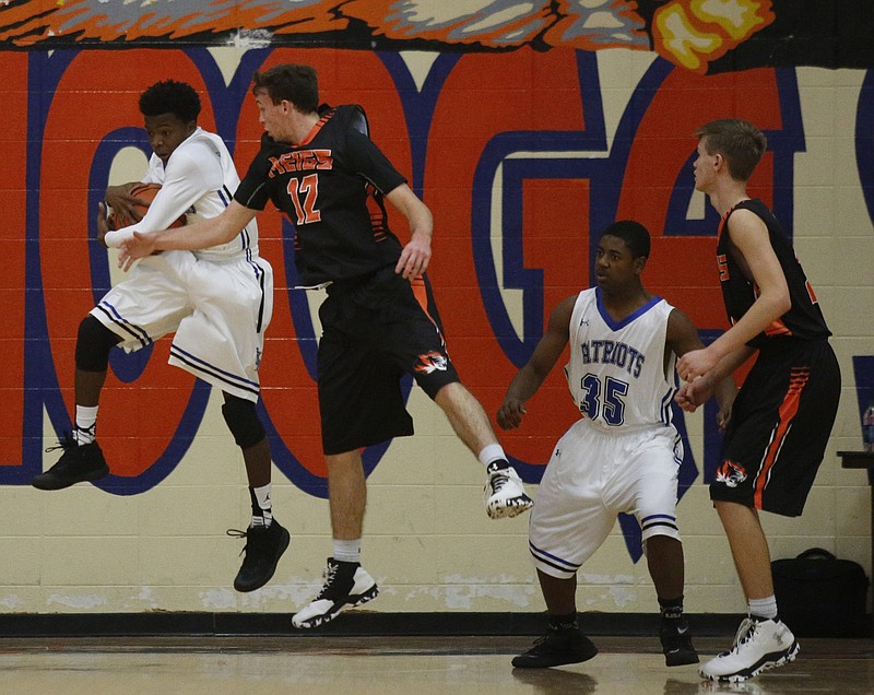 CSAS's Cahlib Edwards, left, rebounds ahead of Meigs County's Jesse Simmons during their Times Free Press Best of Preps Basketball Tournament game at Chattanooga State Technical Community College on Wednesday, Dec. 21, 2016, in Chattanooga, Tenn.
