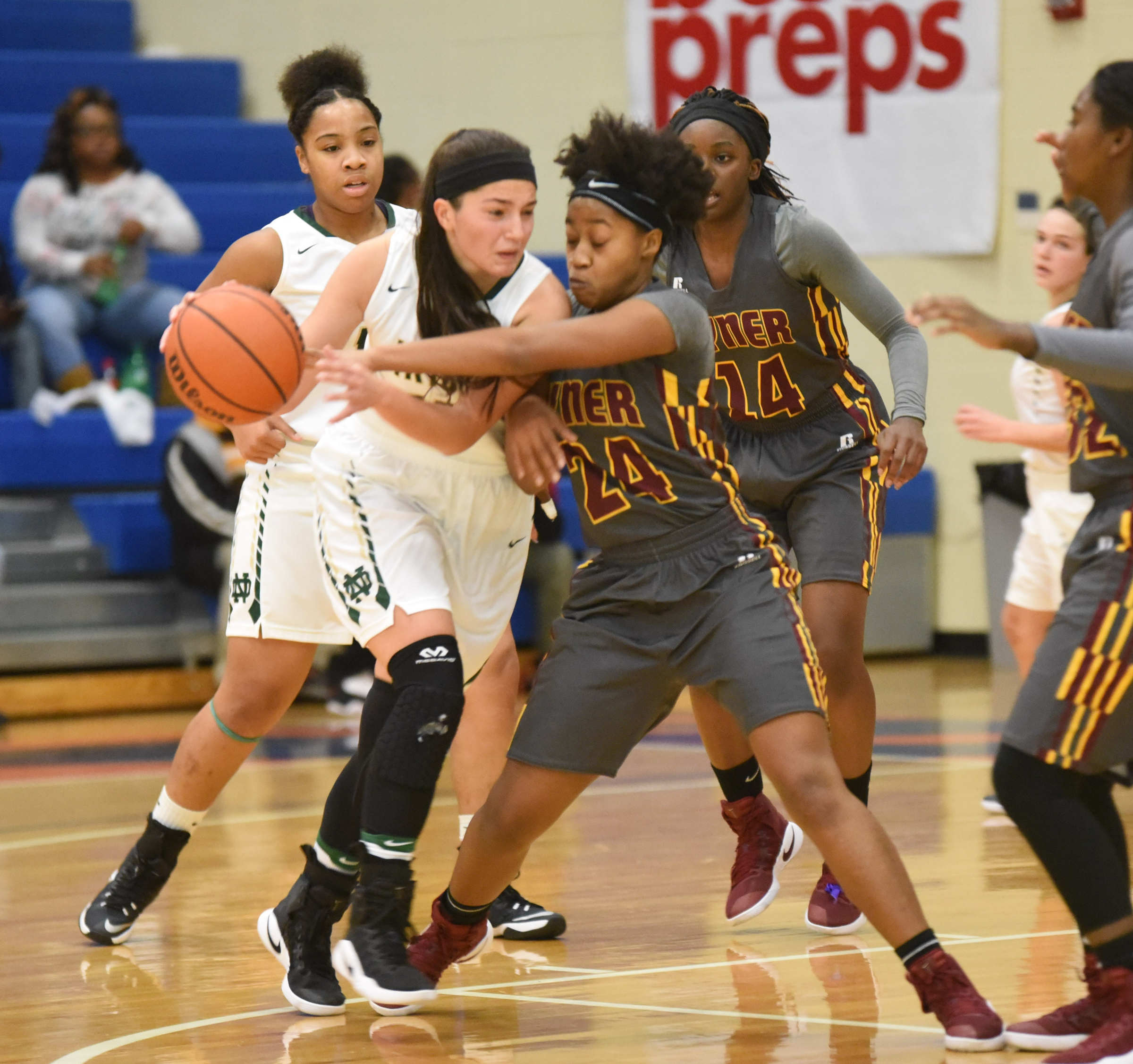 Tyner's Keionna McCutheon (24) reaches in on Notre Dame's Laura Rabuano (15) during action Wednesday in the first round of the Times Free Press Best of Preps basketball tournament at Chattanooga State.