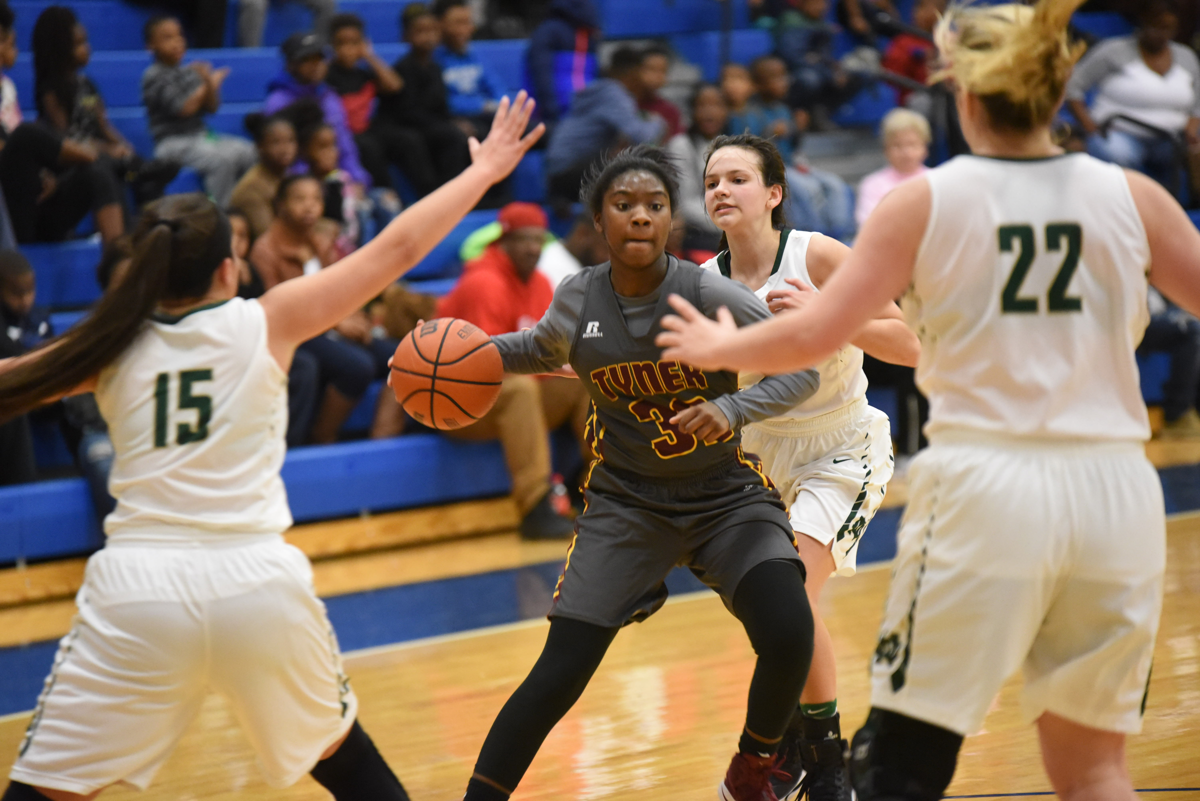 Tyner's Keniah Watkins (32) drives through Notre Dame traffic on her way to the basket in first round action Wednesday at Chattanooga State.