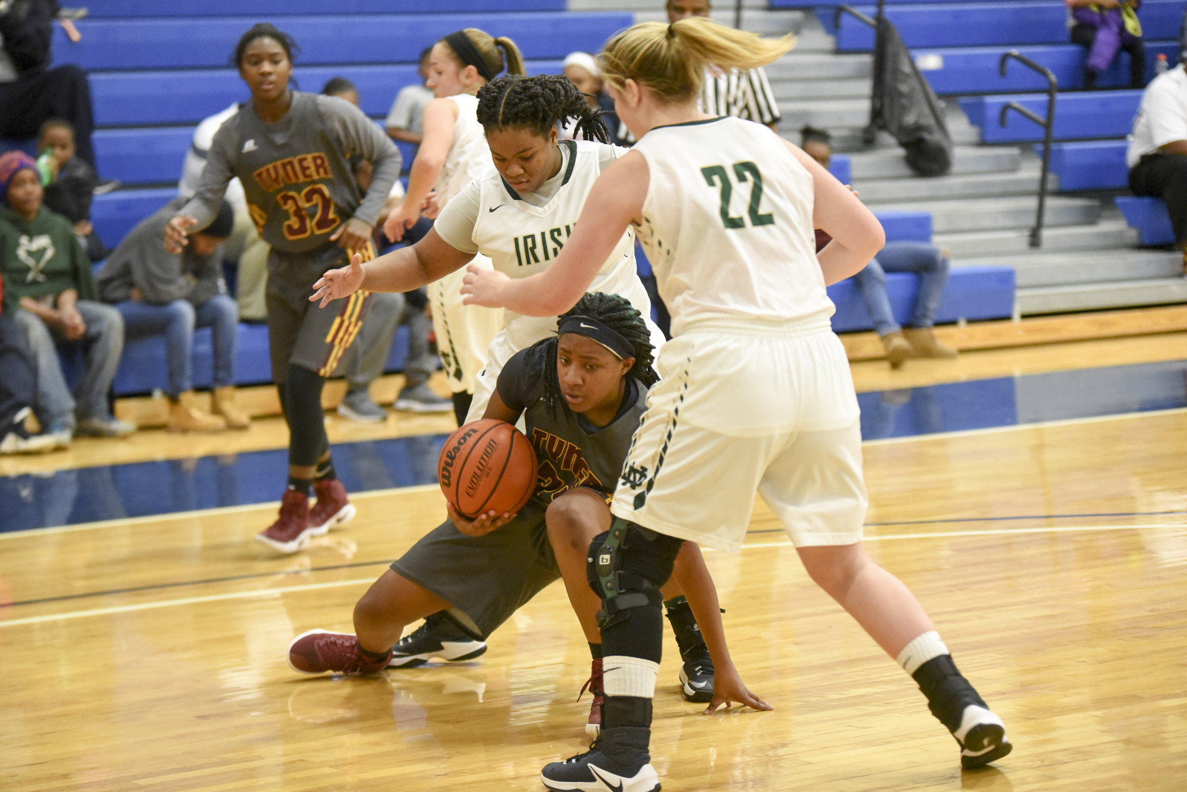 Tyner's Wanda Taylor (33) maintains control of the ball as Notre Dame's Jada Sims, left, and Bella Bombassi (22) close down access to the basket Wednesday in the first round of the Times Free Press Best of Preps basketball tournament at Chattanooga State.