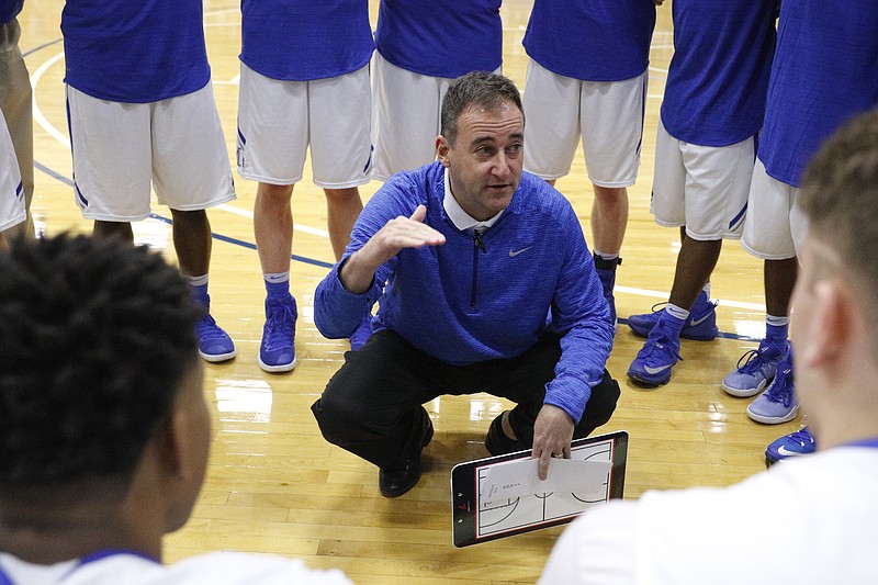 McCallie basketball coach John Shulman talks to players before their Times Free Press Best of Preps Basketball Tournament game at Chattanooga State Technical Community College on Wednesday, Dec. 21, 2016, in Chattanooga, Tenn.