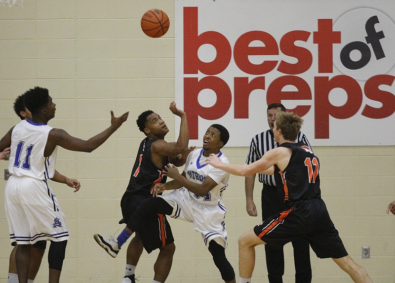CSAS and Meigs County players vy for a rebound during their Times Free Press Best of Preps Basketball Tournament game at Chattanooga State Technical Community College on Wednesday, Dec. 21, 2016, in Chattanooga, Tenn.