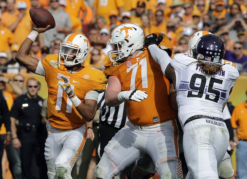 Tennessee quarterback Joshua Dobbs (11) throws a pass as teammate offensive lineman Dylan Wiesman (71) blocks Northwestern defensive lineman Jordan Thompson (95) during the third quarter of the Outback Bowl NCAA college football game Friday, Jan. 1, 2016, in Tampa, Fla. (AP Photo/Chris O'Meara)